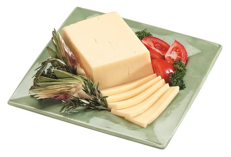 Sharp Cheddar Cheese with Garnish on Green Plate Food Picture