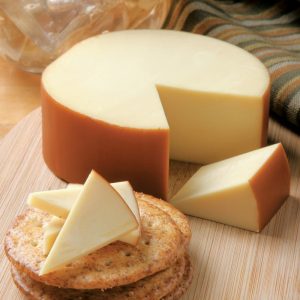 Gouda Cheese with Crackers on Wooden Surface Food Picture