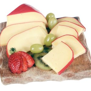 Gouda Cheese on Wooden Board with Fruit Garnish Food Picture