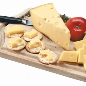 Jarlsberg Cheese on Cutting Board with Garnish Food Picture