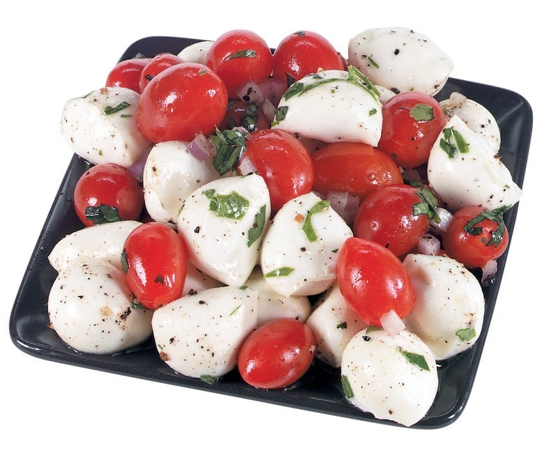 Mozzarella Cheese Balls with Cherry Tomatoes and Basil on Black Plate Food Picture