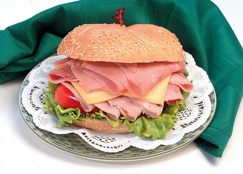 Ham Sandwich on Doily with Green Napkin Food Picture