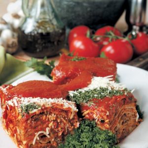 Meat Lasagna with Garnish on White Plate Food Picture
