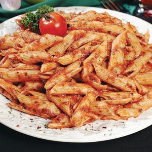 Penne with Marinara Sauce on White Plate with Garnish Food Picture