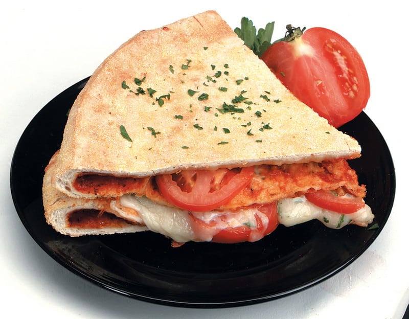 Stuffed Sliced Pizza on Black Plate Food Picture