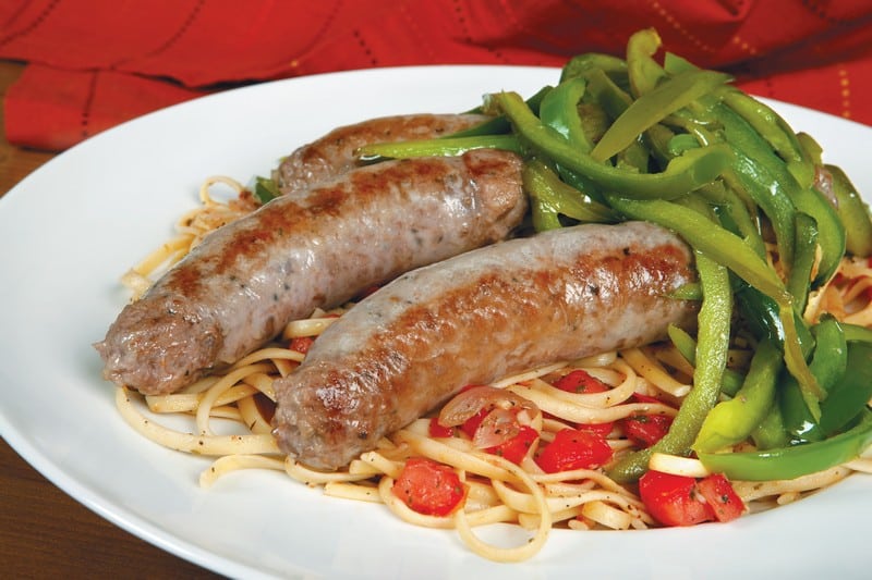 Sausage and Peppers over Pasta in White Dish Food Picture