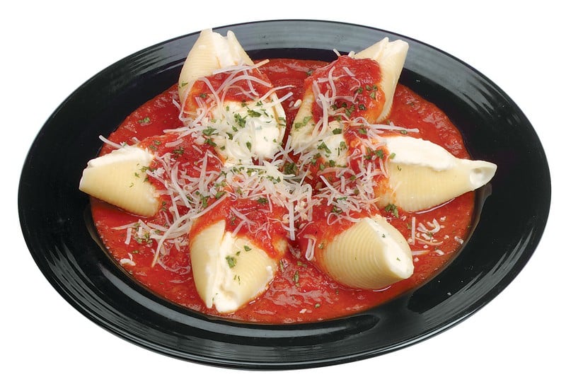Stuffed Shells in Sauce on Black Plate Food Picture