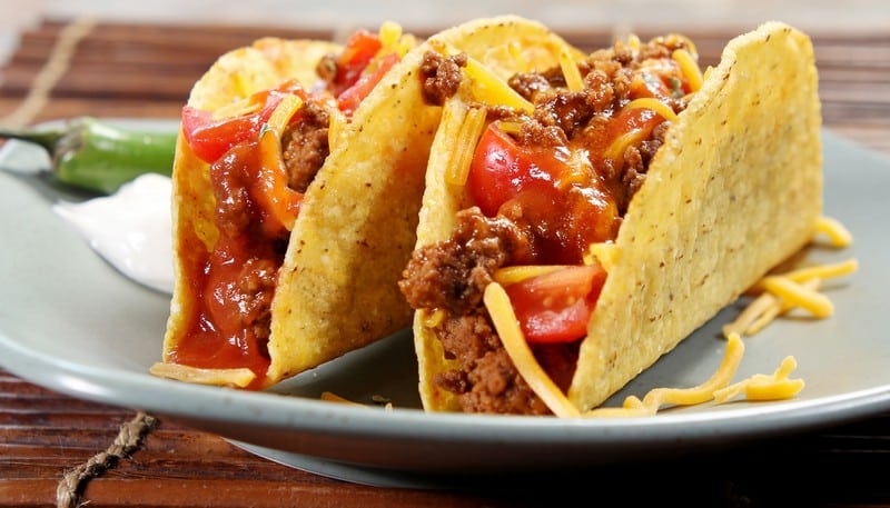 Pair of Hardshell Tacos with Ground Beef, Shredded Cheese, Tomatoes and ...